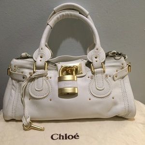 White leather gold lock purse