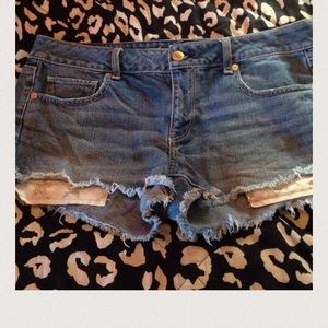 Two pairs of jeans and one pair of shorts