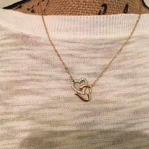gold and silver diamond necklace with 2 hearts