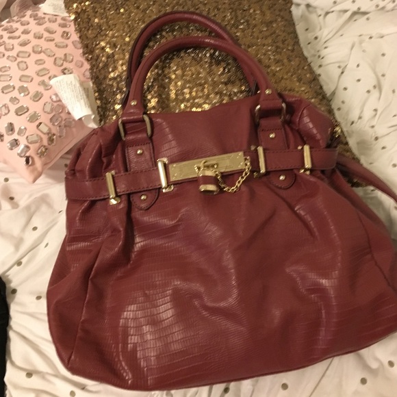 Burgundy Steve Madden bag.