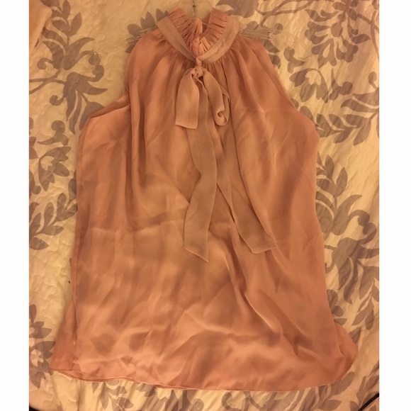 Pale pink sleeveless blouse