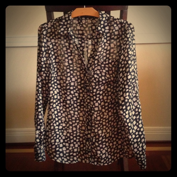 Long sleeve, button down, sheer blouse.