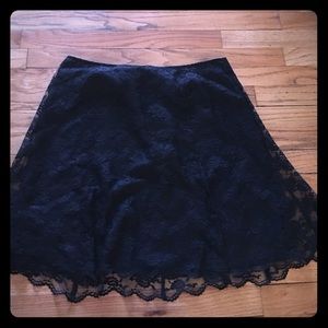 Layered lace skirt, above the knee.