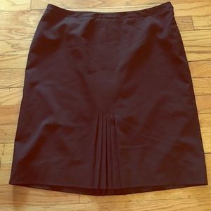 Black skirt with center pleats. Career staple!
