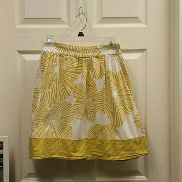 White skirt with yellow flower pattern