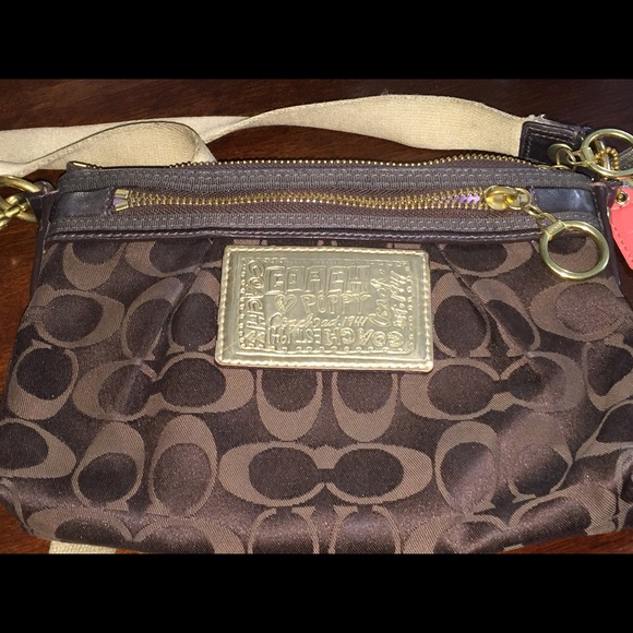 Coach poppy signature metallic brown.