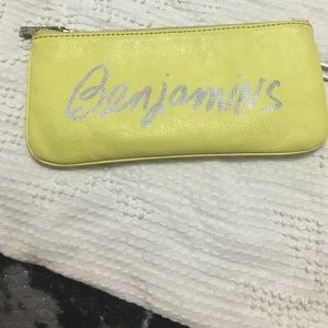 Yellow and silver Benjamin's wallet