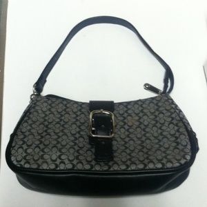 Used miniature coach purse.