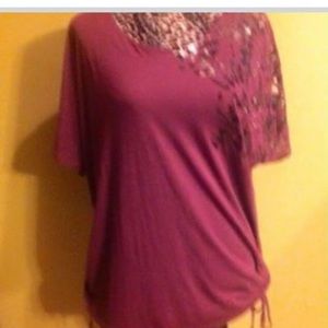 Burgundy top with black/silver design on sleeve
