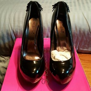 Black patent platform with beaded fringe on heel