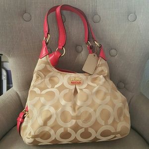 Coral and tan Coach Purse perfect for spring