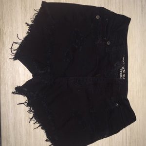 Black ripped shorts