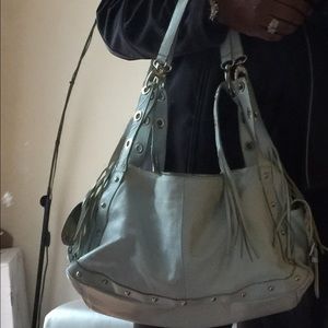 Genuine baby blue leather handbag.