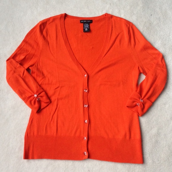 bright orange cardigan
