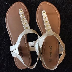 Tan flat sandals from wet seal.