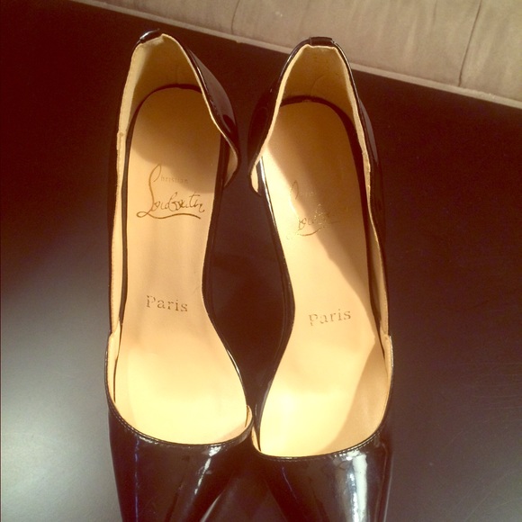 Black patent leather with red soles.