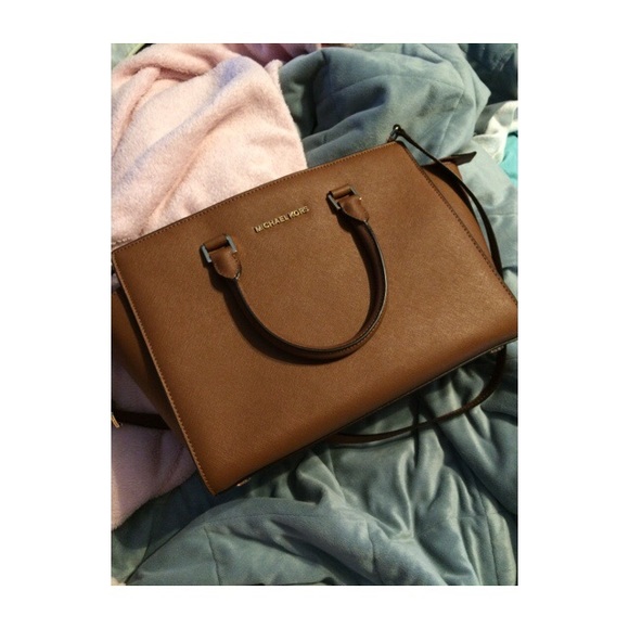 Large MK Selma luggage.