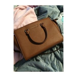 Large MK Selma luggage.