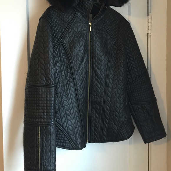 Women's black leather coat.