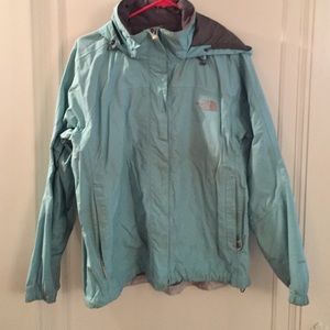 Turquoise Northface rain jacket.