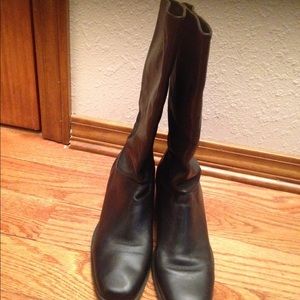 Black midcalf leather boots.