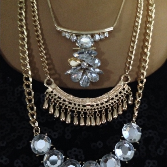 Three gold necklaces.