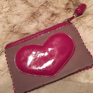 Small bag with patent pink heart.