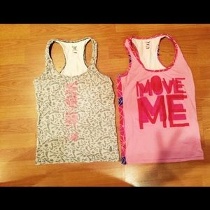 4 Zumba tanks size large .