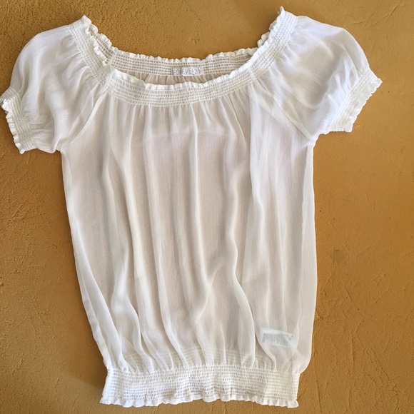 Light stretchy top. See through.