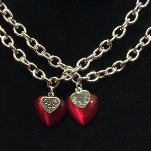 2 Friends Forever bracelets. Lovely red cat's-eye