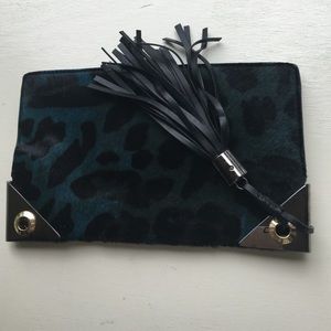 Henri Bendel calf hair clutch w leather tassel