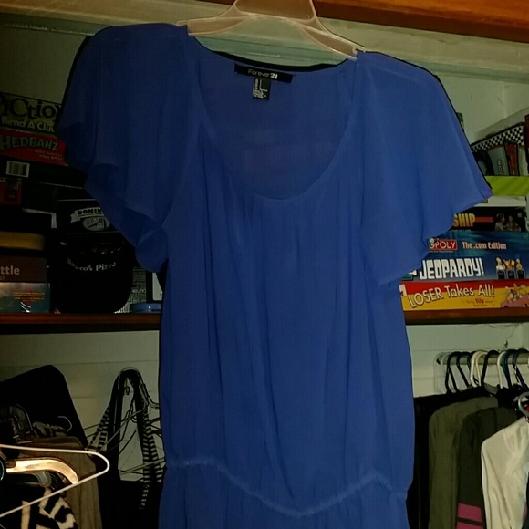 Blue see through peplum style shirt. New without t