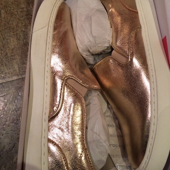 Gold slip on sneakers