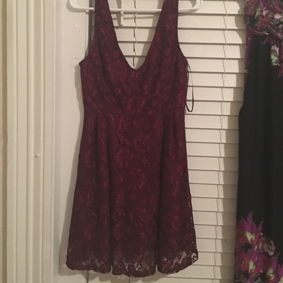 Wine colored dress, V cut back.