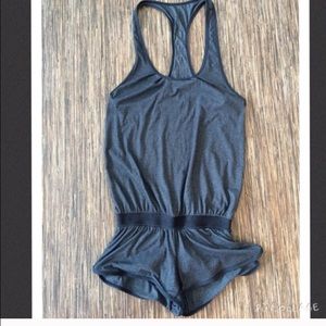 Super cute gray romper it dresses adorable !