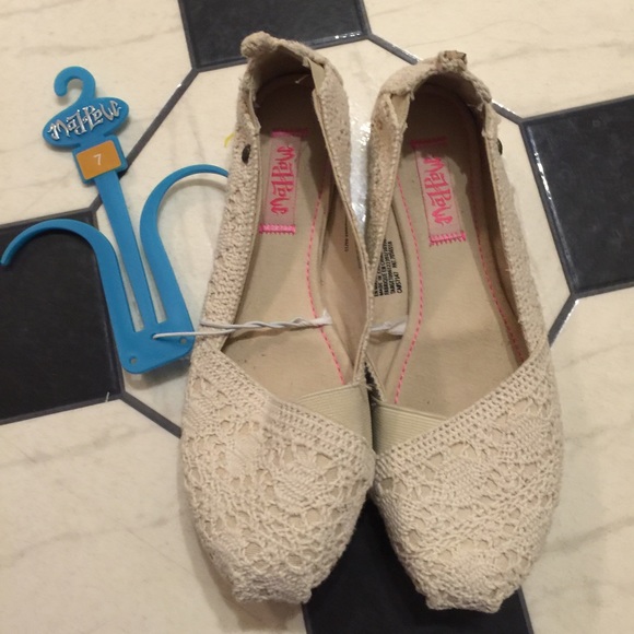 Brand new slip on cream colored shoes.