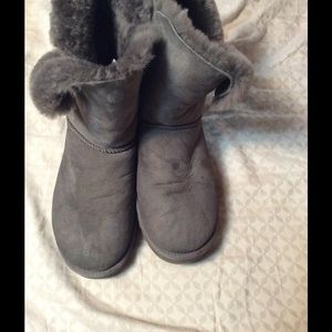 Women's grey short UGG boots with buttons