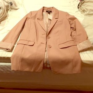 A cute creamish/pinkish coat.