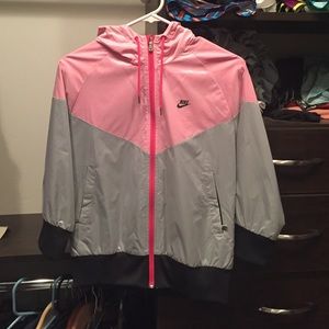 Pink, gray, and black nike waterproof jacket.