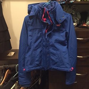 Blue Hollister winter coat with pink detailing.
