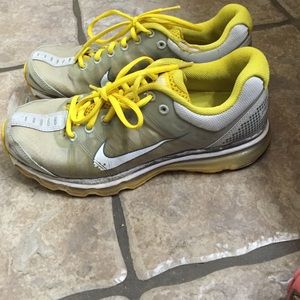 Yellow and white Air Max Nike running shoes