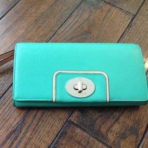 Turquoise Kate Spade wristlet.
