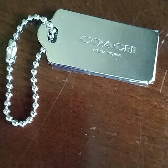 Coach metal tag