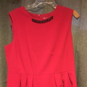 New York and Company red top with beaded neckline.