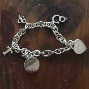 Knock off Tiffany & Co. Multi charm bracelet.