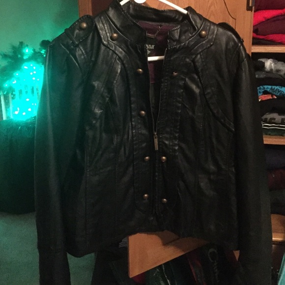 Black "leather" jacket.