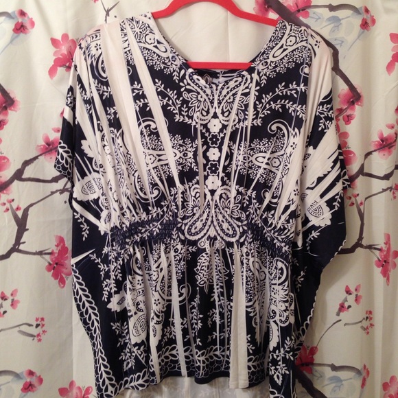 Winged arm blouse