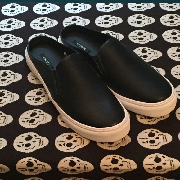 Black and white sneaker slides