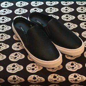 Black and white sneaker slides