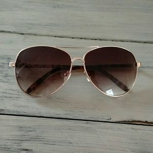 Gold framed aviator style sunglasses